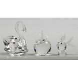 A collection of (3) Swarovski figurines including a swan. d