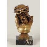 A bronze head representing Christ the man of sorrows. signe