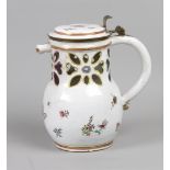 An enamel open worked pitcher decorated with flowers. 19th