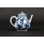 A porcelain teapot with twisted floral decoration in flower