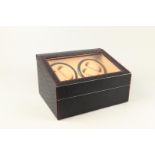 A leather watch winder for 4 watches.