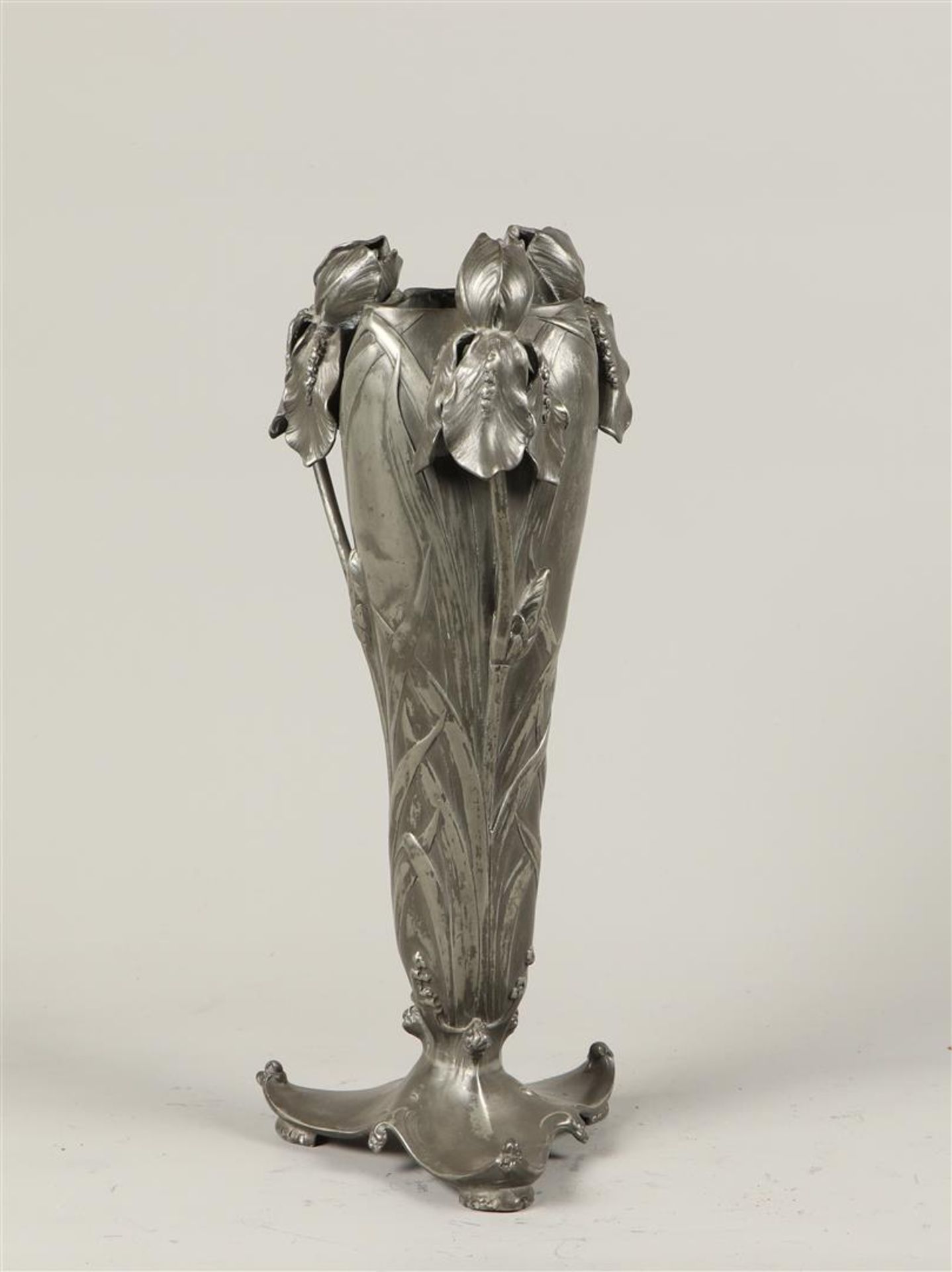 A pewter flower vase with Irises, marked B&G Imperial Zinn.