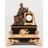 A capital mantel clock. The string timepiece is housed in a