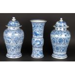 A porcelain garniture set consisting of two lidded vases an