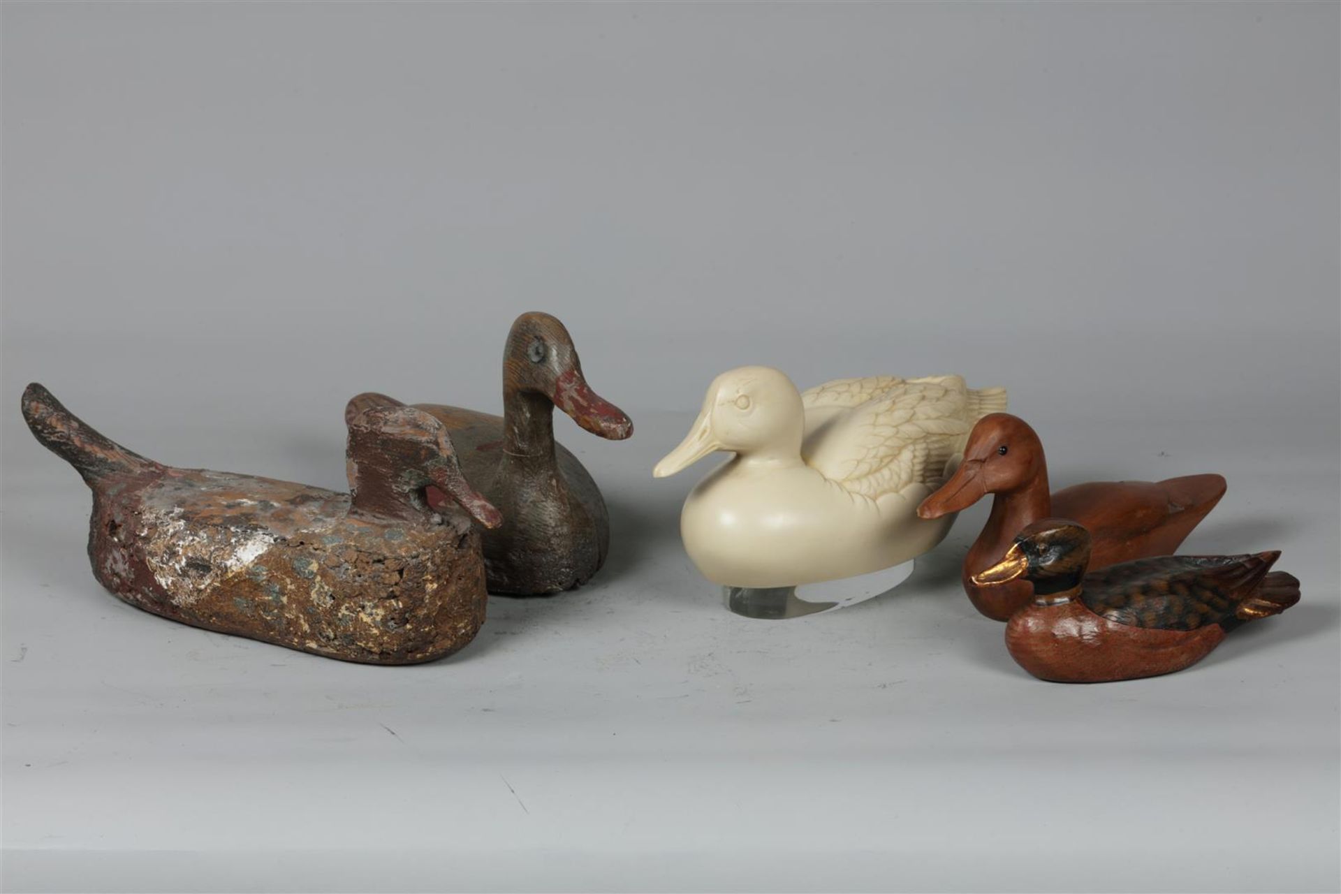 A lot of mostly wooden decoy ducks. 20th century.