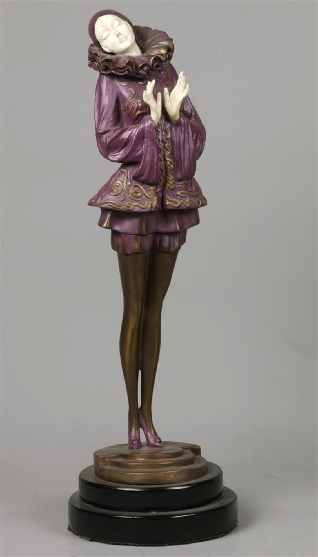 A cold-painted bronze in the shape of an Art Noveau lady wi