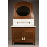 A Dutch oak washbasin furniture with white marble top, and