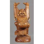 A wooden so-called happy face Buddha. 2nd half of the 20th