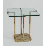 A brass side table with glass top. H.: 50 cm.