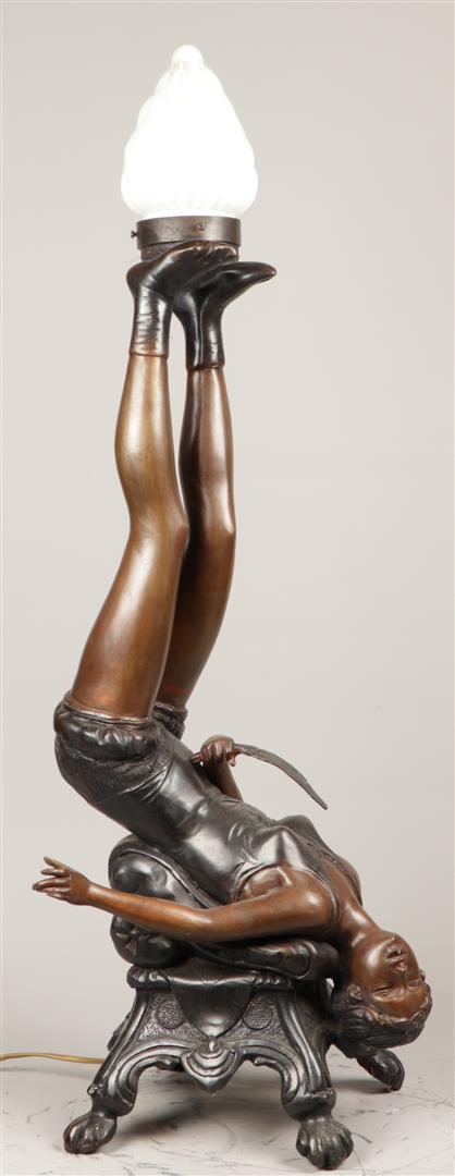 A bronze lamp holder in the shape of an acrobat, resting on - Image 2 of 2