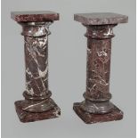 A set of red marble columns. H.: 90 cm.