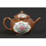 A porcelain Famille Rose teapot with a capuchin exterior. C