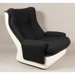 A white space age plastic lounge armchair with black uphols