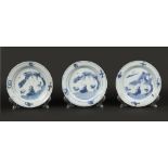 A set of porcelain plates with a figure in a landscape desi