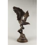 A large brown patinated bronze in the shape of an eagle. 2n