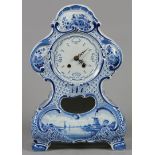 An earthenware mantel clock with floral decor, marked Porce