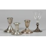 A lot consisting of (3) candlesticks, and a glass with silv