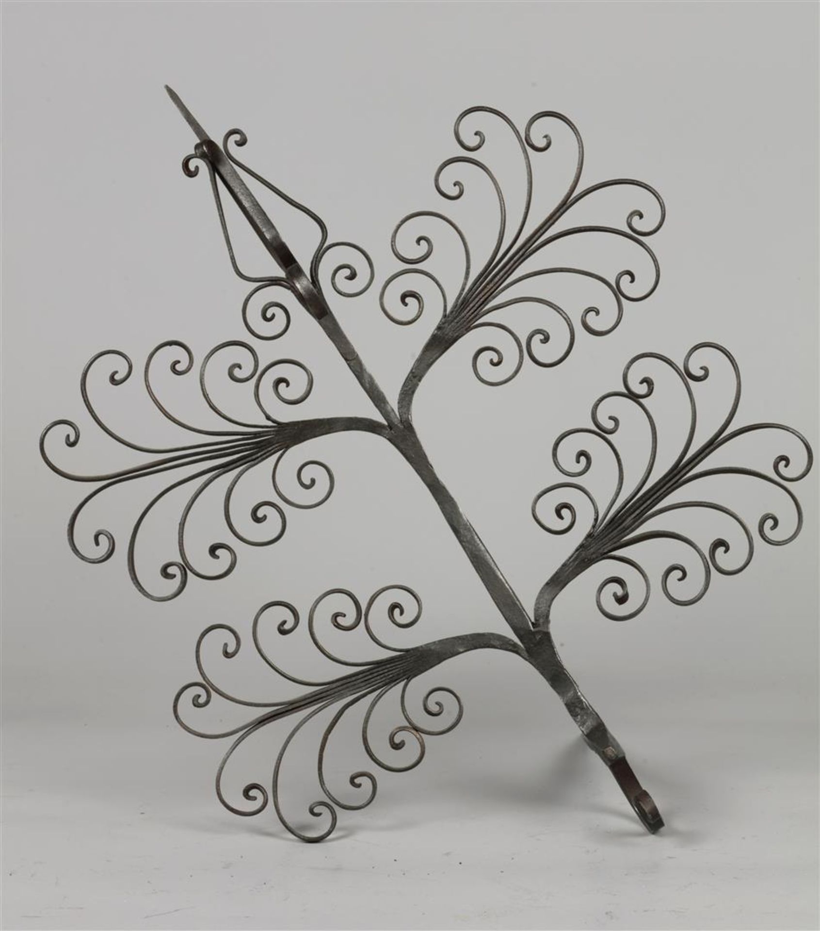 A wrought iron wall candlestick. Spain, 19th century.
H.: 3