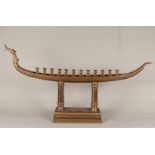 A large bronze candlestick in the shape of a dragon boat. 2