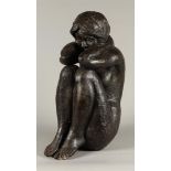 A dark patinated bronze statue of a squatting girl. 2nd hal