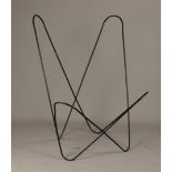 A black powder-coated frame of a Butterfly chair/ BKF chair