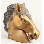 A brass horse's head. 2nd half of the 20th century. H.: 31