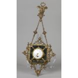 A "hanging" clock in brass housing and enamel dial. France,