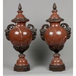 A pair of monumental red marble casolettes on a bronze base