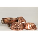 A lot of copper including baking molds and a large fruit bo