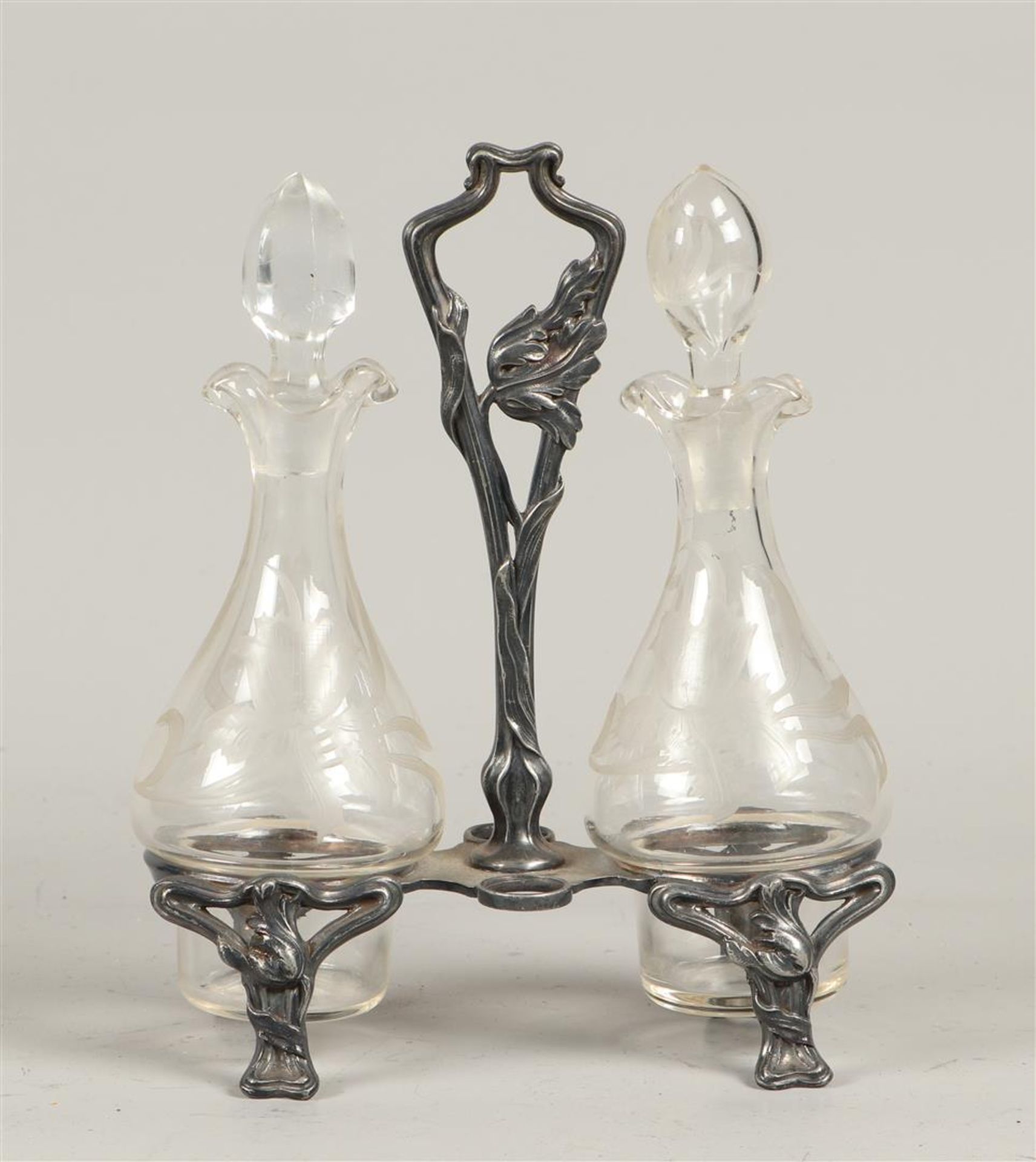 A pewter Jugendstill table set with two engraved decanters.