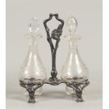 A pewter Jugendstill table set with two engraved decanters.