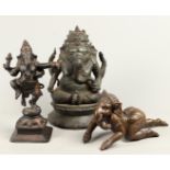 A lot containing (3) bronze statues of a sitting, a crawlin