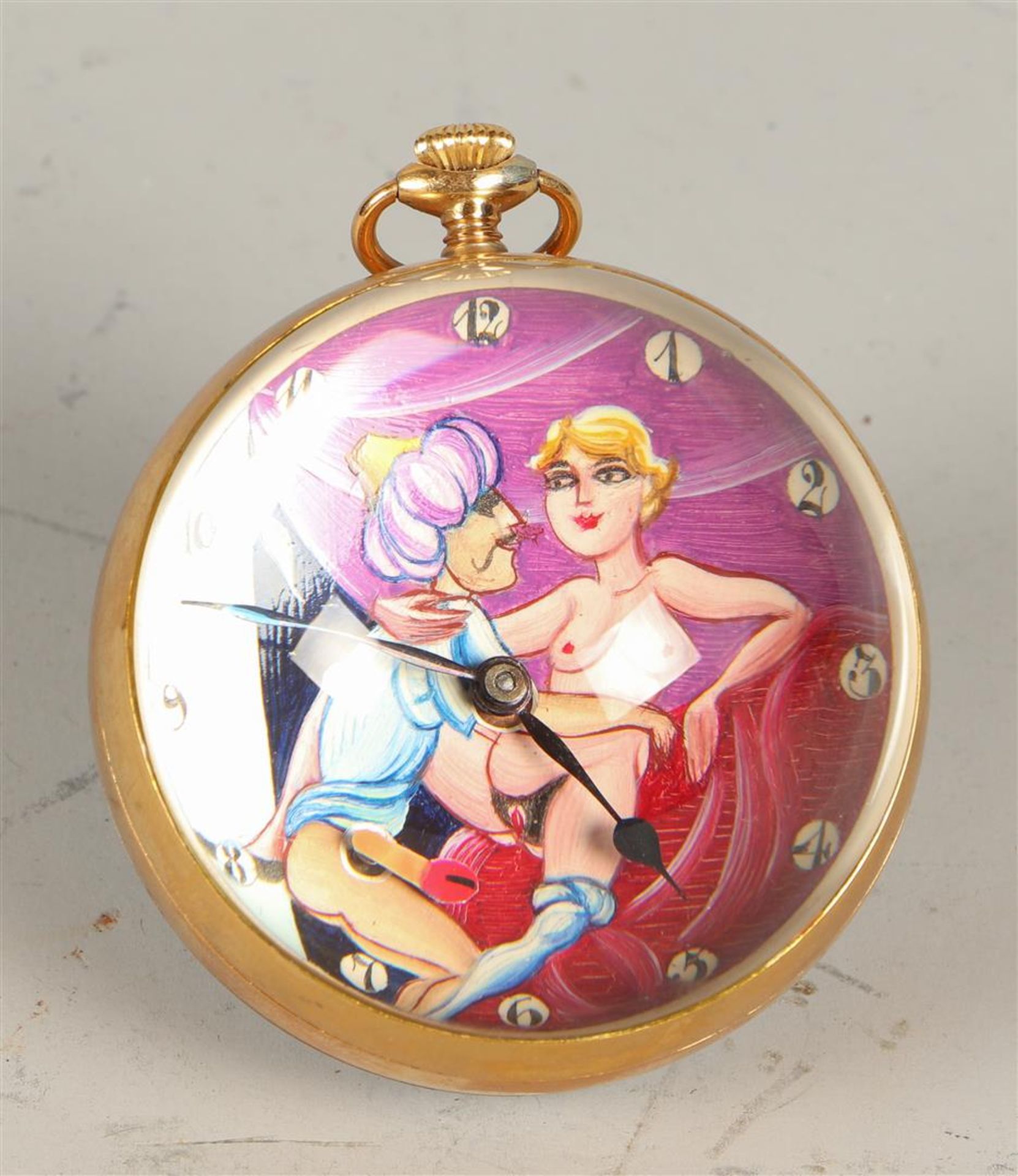 A round desk clock with an erotic scene. Late, 20th century