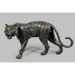 A large bronze sculpture of a tiger. Second half of the 20t