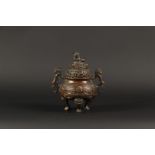 A bronze incense burner decorated with dragons, marked on t