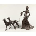 A bronze art deco style sculpture of an elegant lady with t