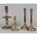A lot consisting of (4) candlesticks, including a disc cand