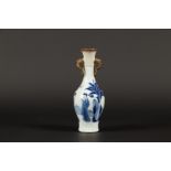 A porcelain trumpet vase with elephant ears with rings (par