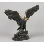 A bronze sculpture of an osprey with wings spread. Late 20t