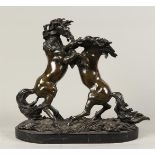 A bronze group of fighting stallions, 20th century. H.: 37