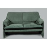 A vintage Leolux double sofa covered with green fabric. Mod