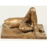 A bronze statue of a reclining male nude. 2nd half of the 2