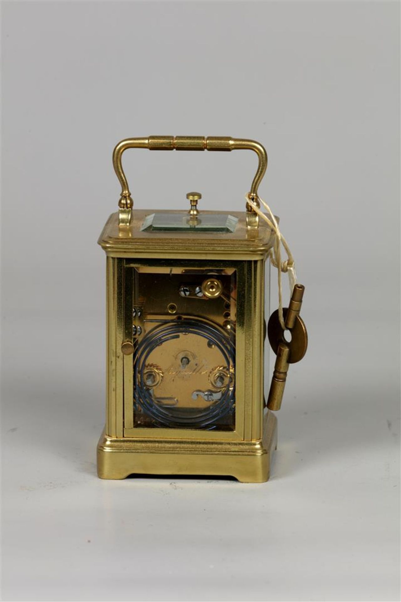 A brass travel alarm clock, white enamel dial shows the hou - Bild 3 aus 3