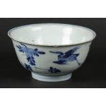 A porcelain bowl decorated with flying cranes, marked with