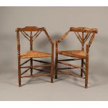 A set of (2) oak corner chairs with rush seats and turned l