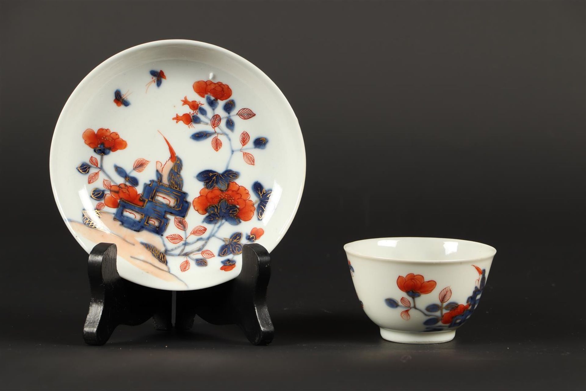 A porcelain cup and saucer with Imari decor. China, 18th ce