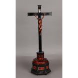 A 19th century crucifix on tortoiseshell base. H.: 45 cm.