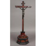 A 19th century crucifix on tortoiseshell base. H.: 70 cm.