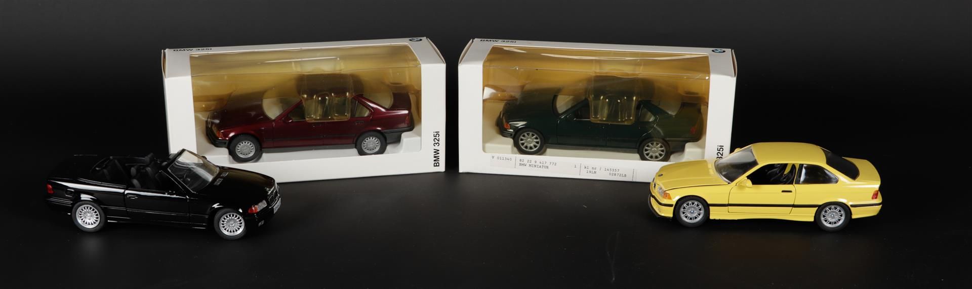 A lot of 4 model cars consisting of a BMW3er convertible, M