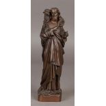 Een bronzen sculptuur van Christus als De Goede Herder. Ges